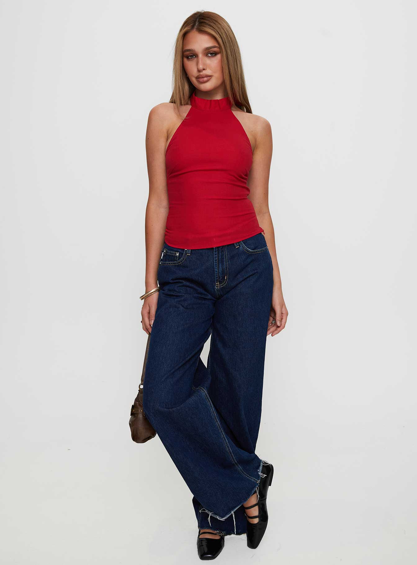 side view of model wearing Princess Polly Merril Halter Top Red Sleeveless High Neck 