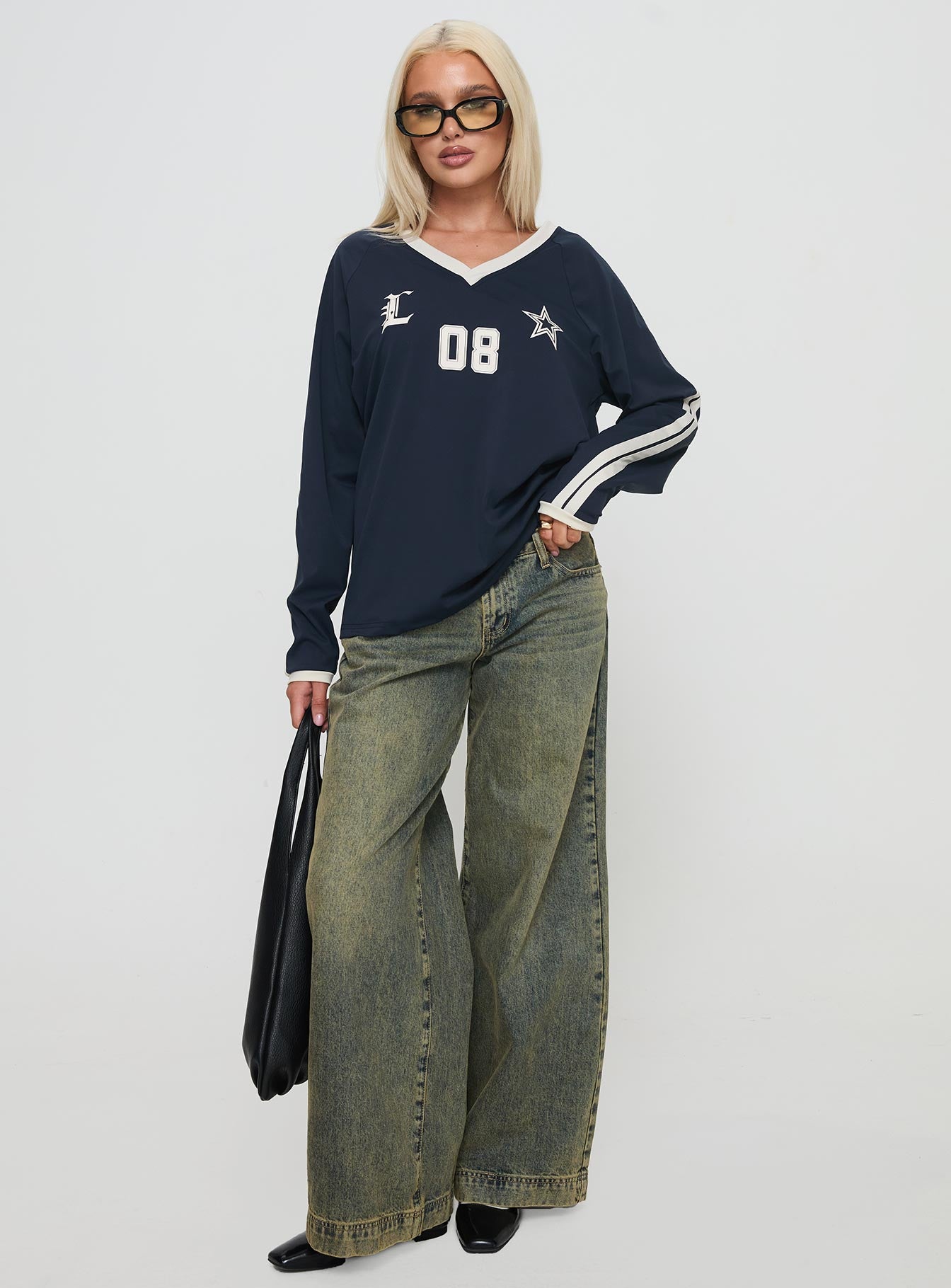 front view of model wearing Princess Polly Spectate Top Long Sleeve Navy Full Sleeves V-Neck 