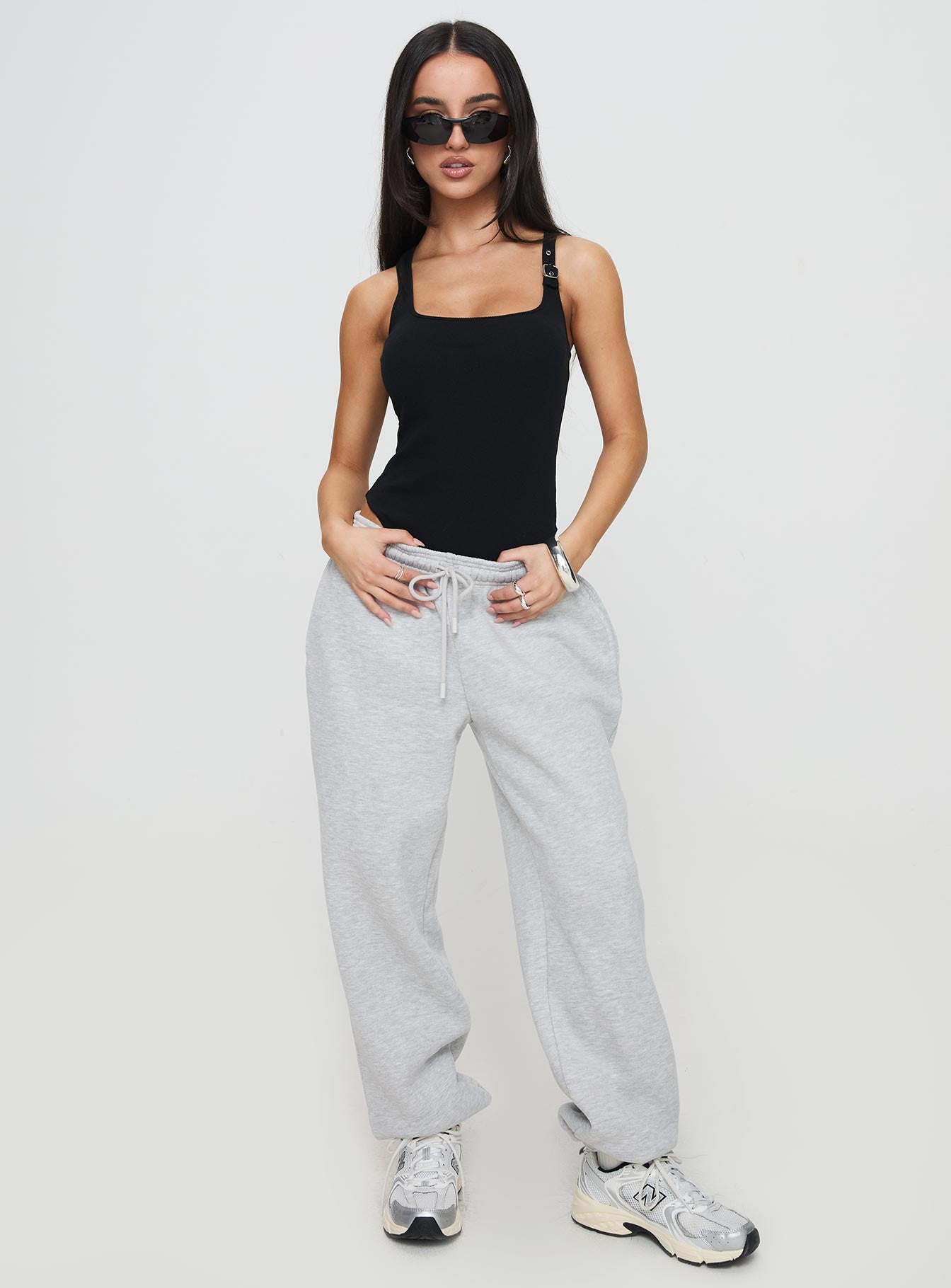 front view of model wearing Princess Polly Novelle Bodysuit Black Sleeveless Square Neck 