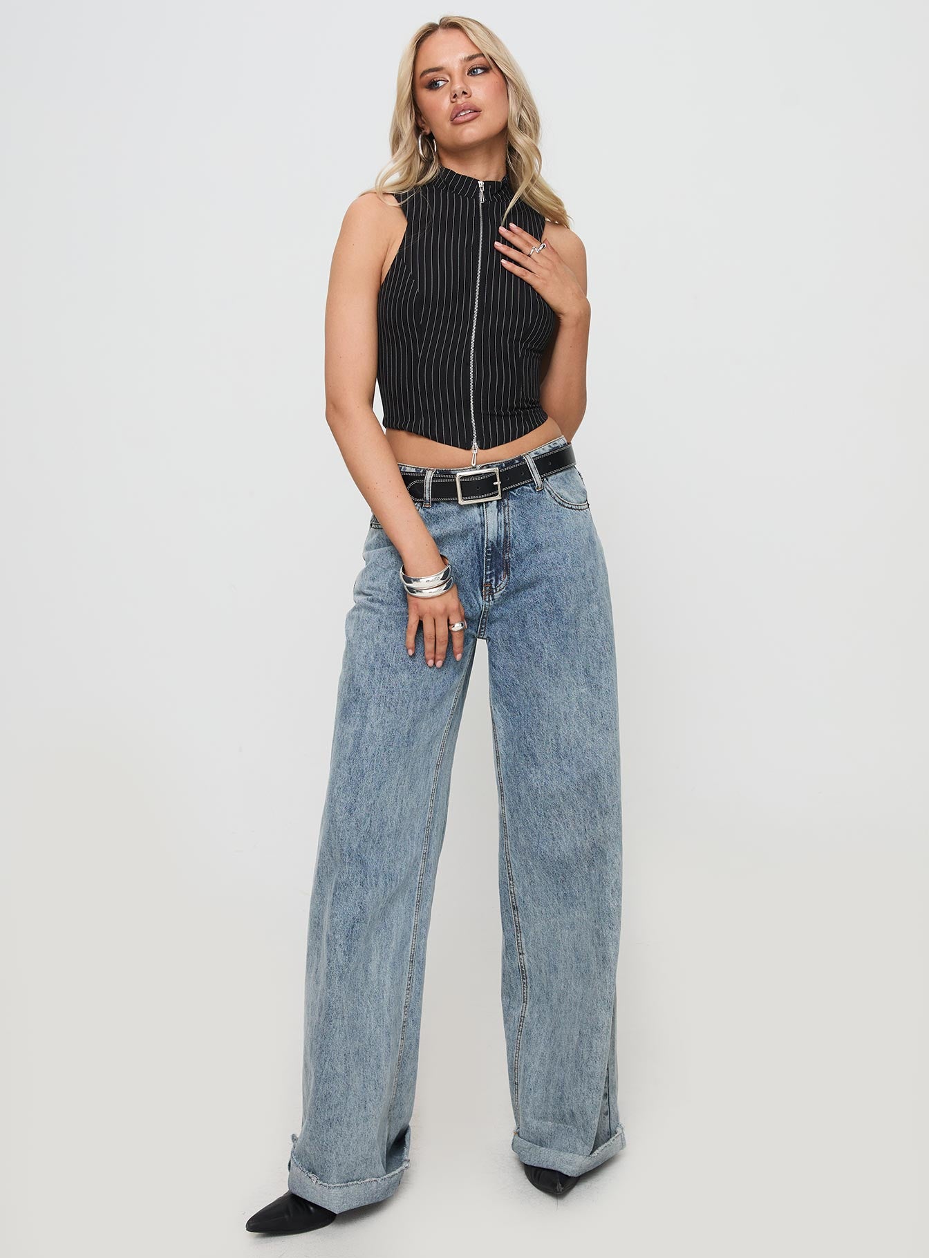 front view of model wearing Princess Polly Messa Top Black Pinstripe Sleeveless High Neck 