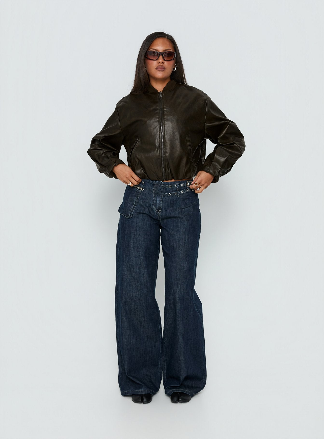 front view of model wearing Princess Polly Paltrow Mid Rise Wide Leg Cargo Jeans Dark Blue Wash Mid Rise Jeans 