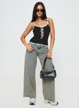 side view of model wearing Princess Polly Jaycee Low Rise Wide Leg Jeans Antique Wash Low Rise Jeans 