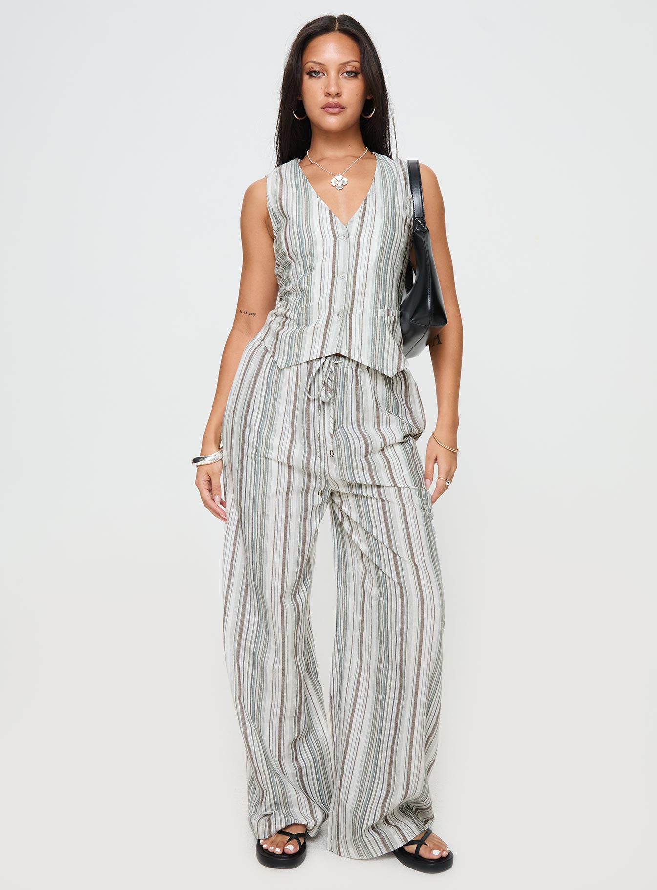 front view of model wearing Princess Polly Flutters Vest Top White / Blue Stripe Sleeveless V-Neck 