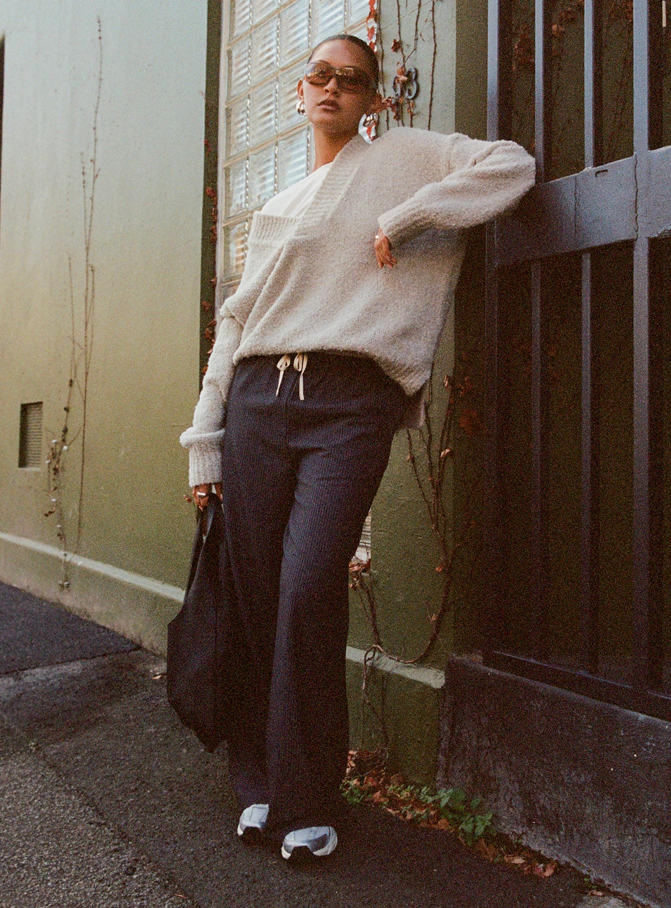 side view of model wearing Princess Polly Seraphic Pants Charcoal Stripe High Waisted Pants 