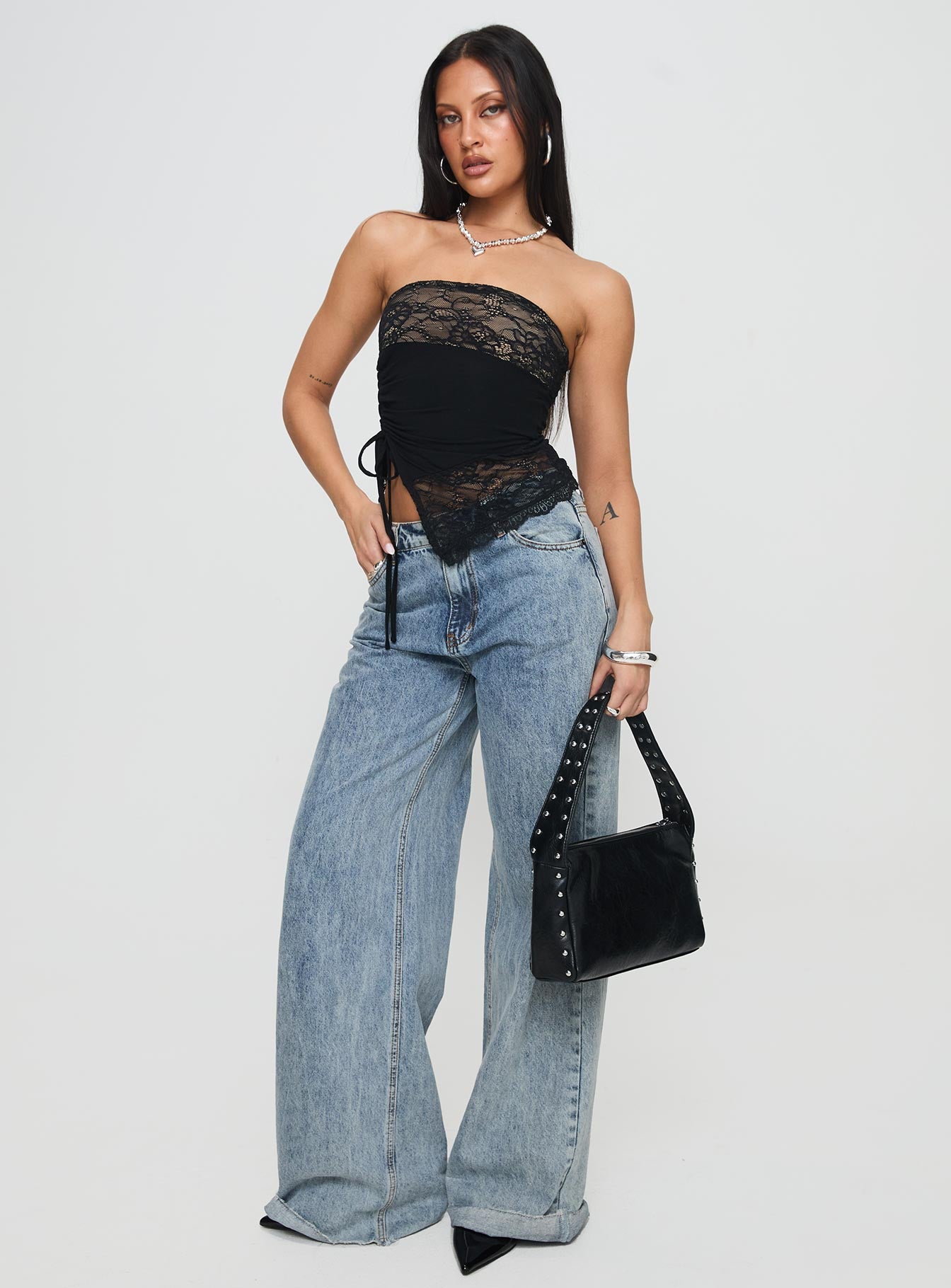 side view of model wearing Princess Polly Chianti Strapless Top Black Sleeveless straight 