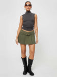 Low rise mini skirt Folded waist, zip and clasp fastening, twin hip pockets, pleated design