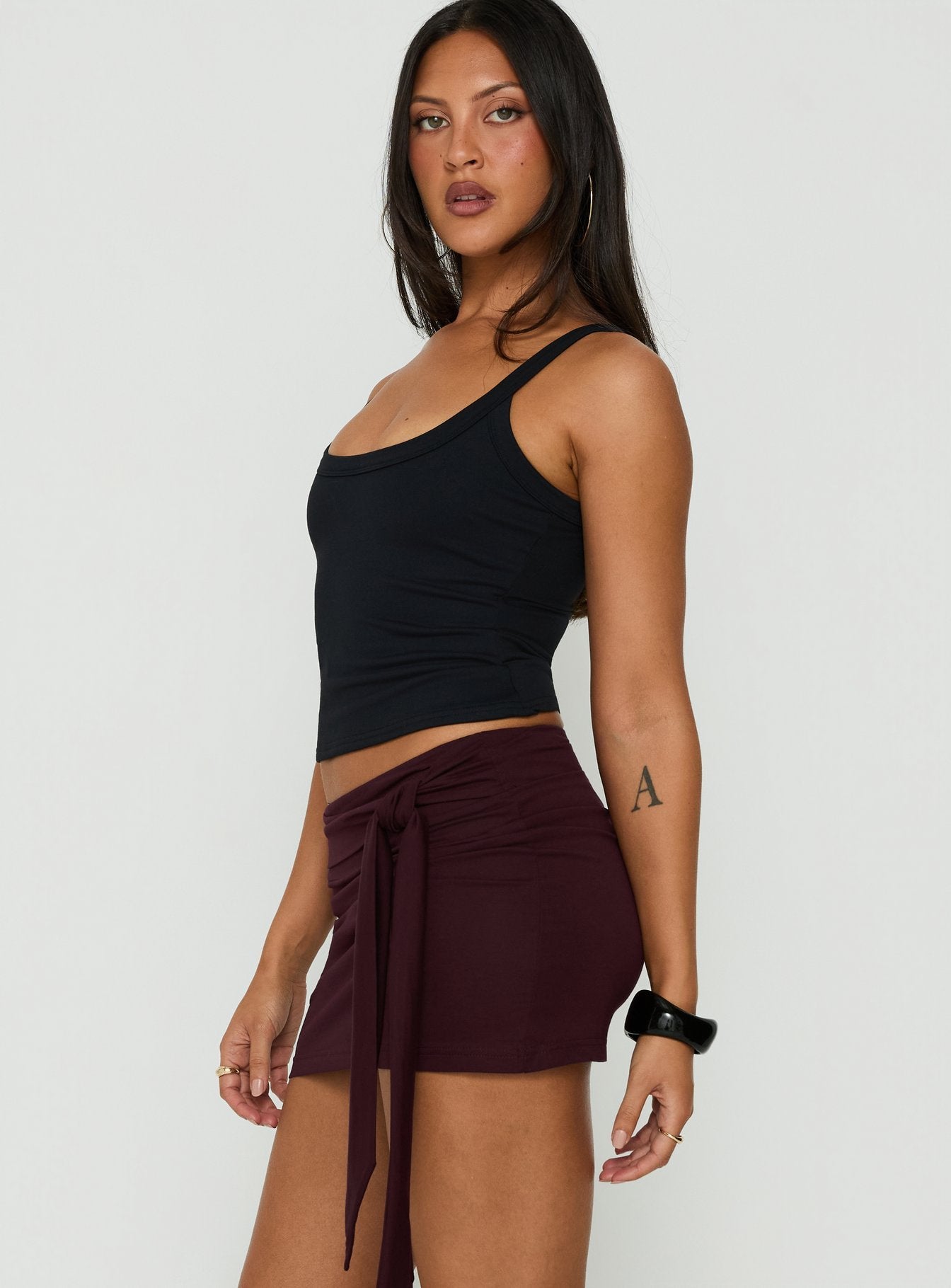 Crafted with the Eldric Tie Waist Micro Skirt Aubergine womens-skirts in mini length side view of model wearing