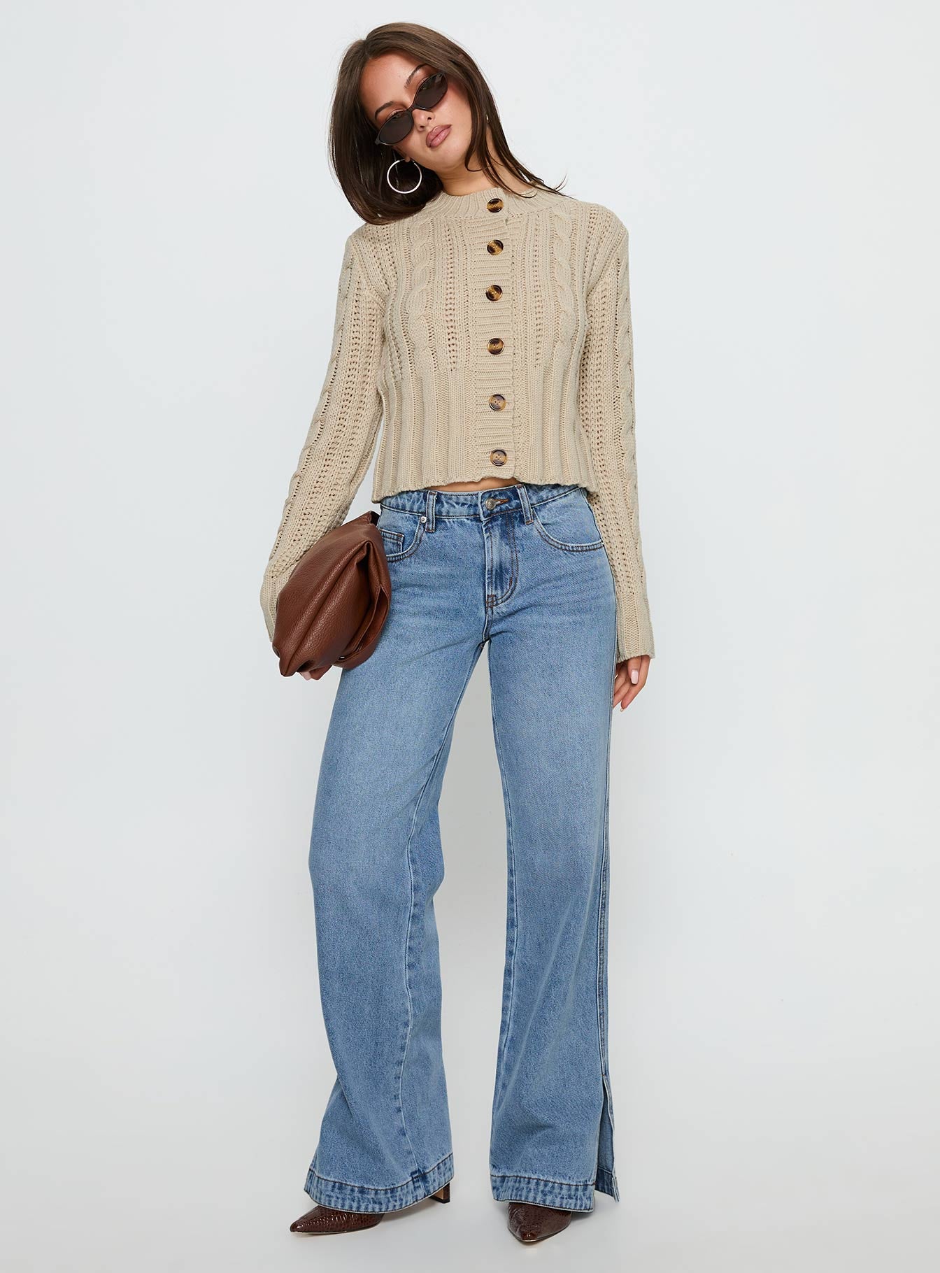 side view of model wearing Princess Polly Donielle Cable Knit Cardigan Beige cropped 