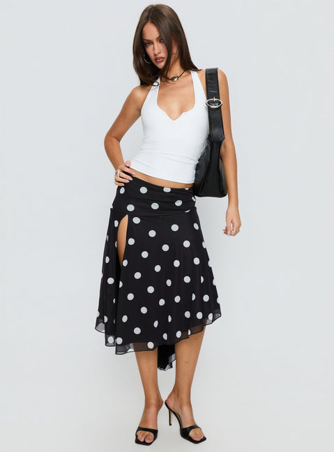   side view of model wearing Princess Polly Dulciana High Split Asymmetrical Midi Skirt Black / Polka Dot Midi Skirts 