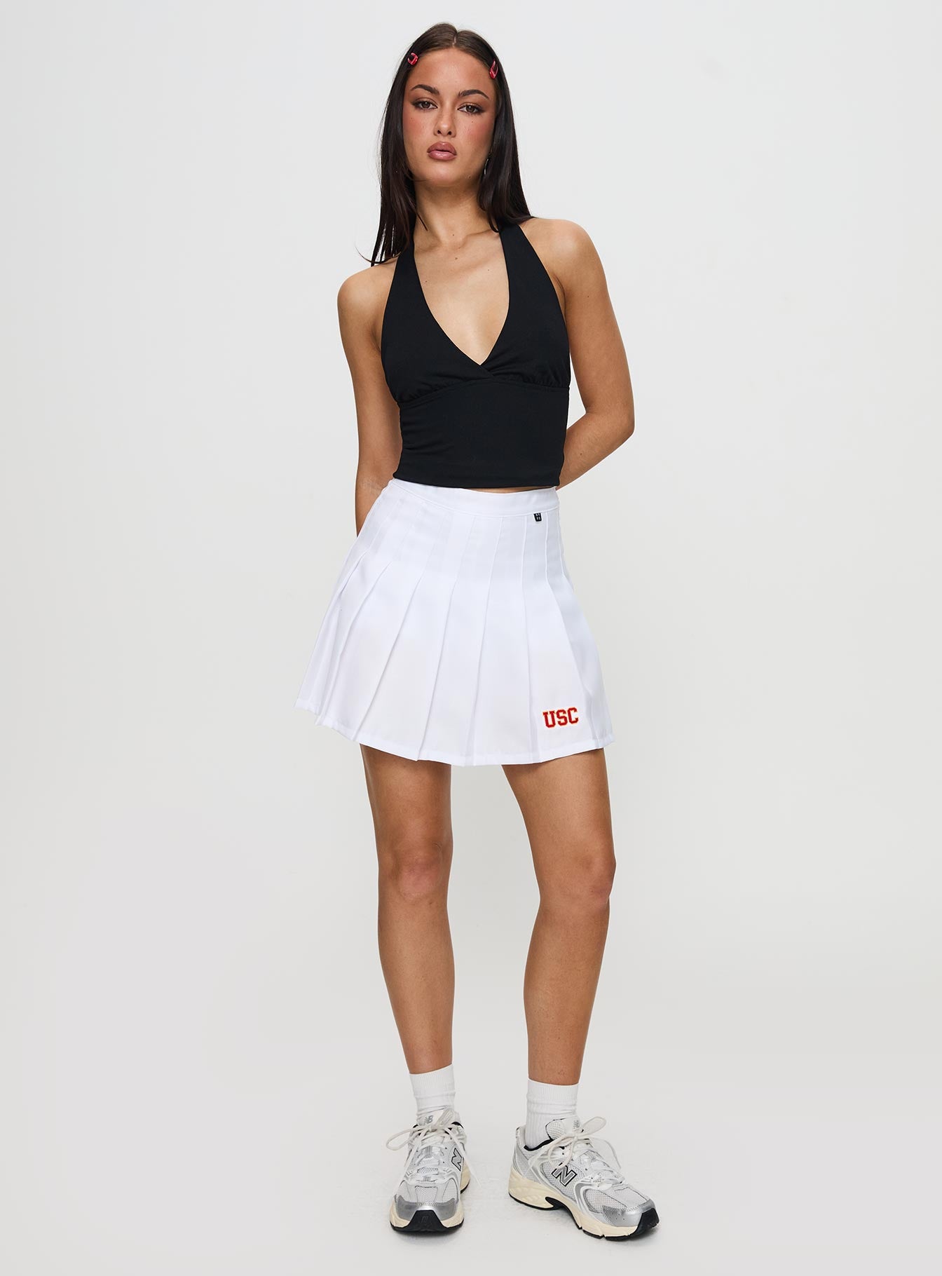   front view of model wearing Princess Polly USC Tennis Skort White 