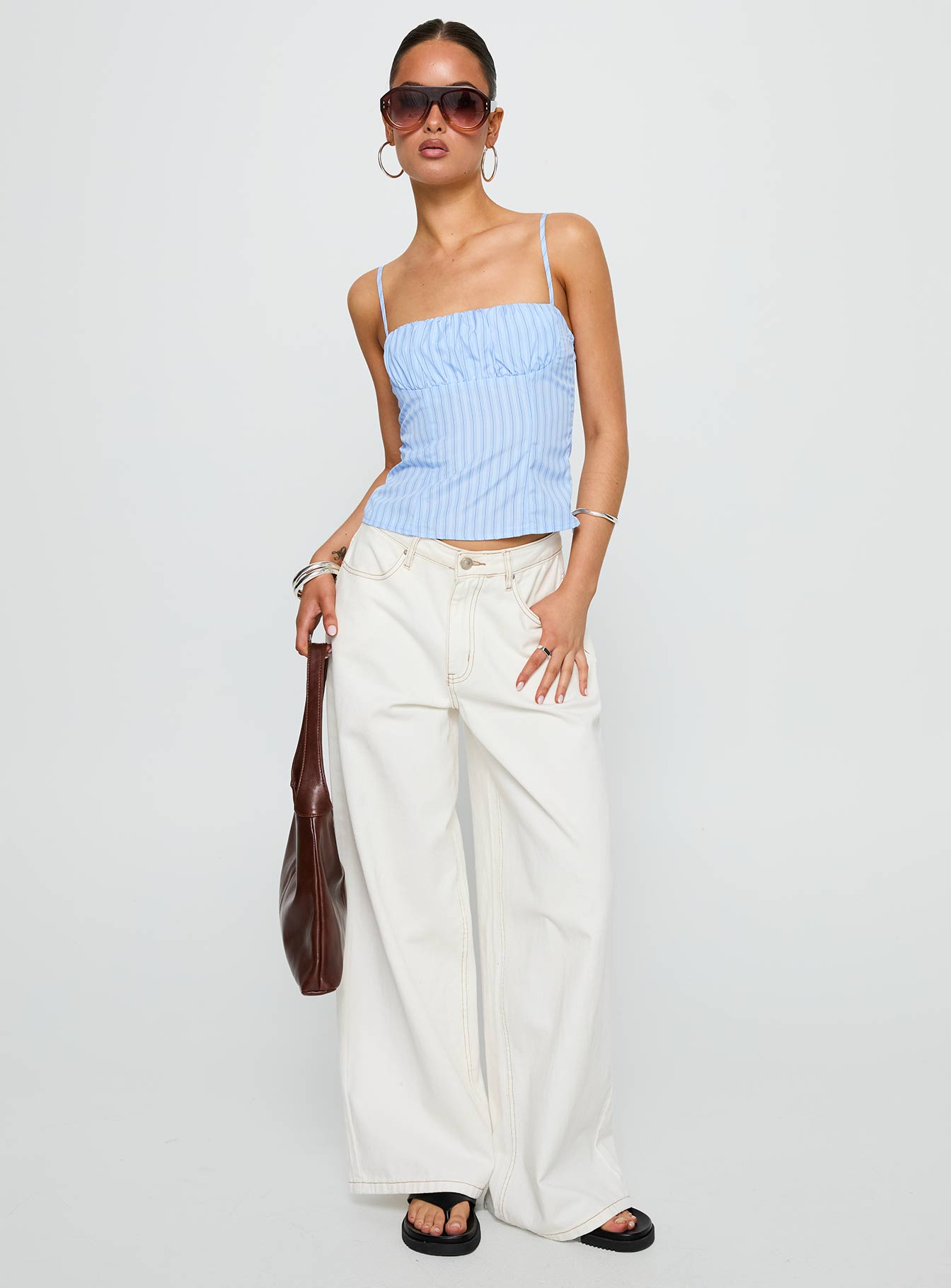 front view of model wearing Princess Polly Isolabella Top Blue Stripe Sleeveless Square Neck 