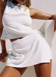 back view of model wearing Princess Polly Gulliver Tie Side Mini Skort White High Waisted Shorts 