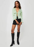 Long sleeve top, silky material Open front, tie fastening, ruched bust, lace detailing, flared cuff