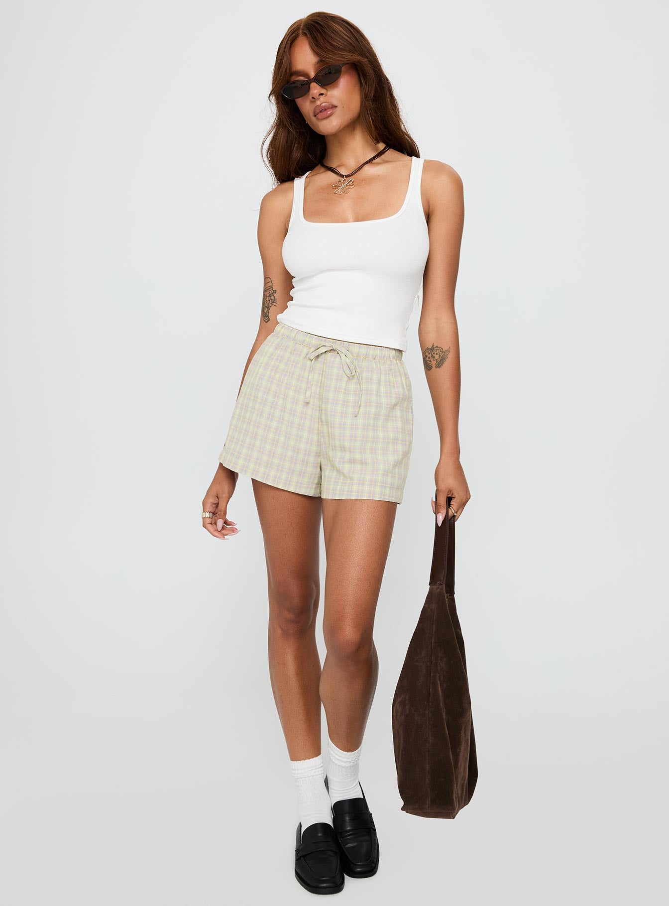 back view of model wearing Princess Polly Star Blaze Shorts Green Check High Waisted Shorts 