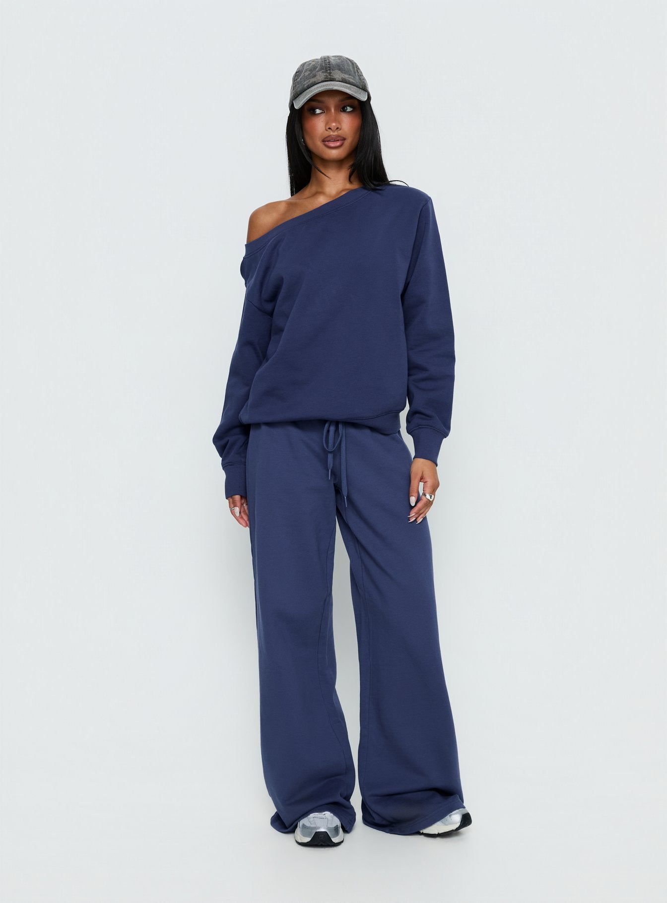 side view of model wearing Princess Polly Wellness Off the Shoulder Jumper Navy 