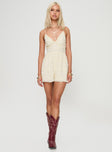 Romper V neckline, adjustable straps, open back with cross-over detail, tie fastening Non-stretch material, fully lined 