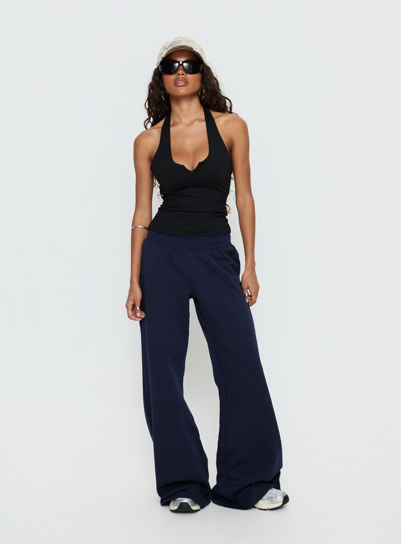front view of model wearing Princess Polly Summits Flared Track Pants Navy Mid Rise Pants 