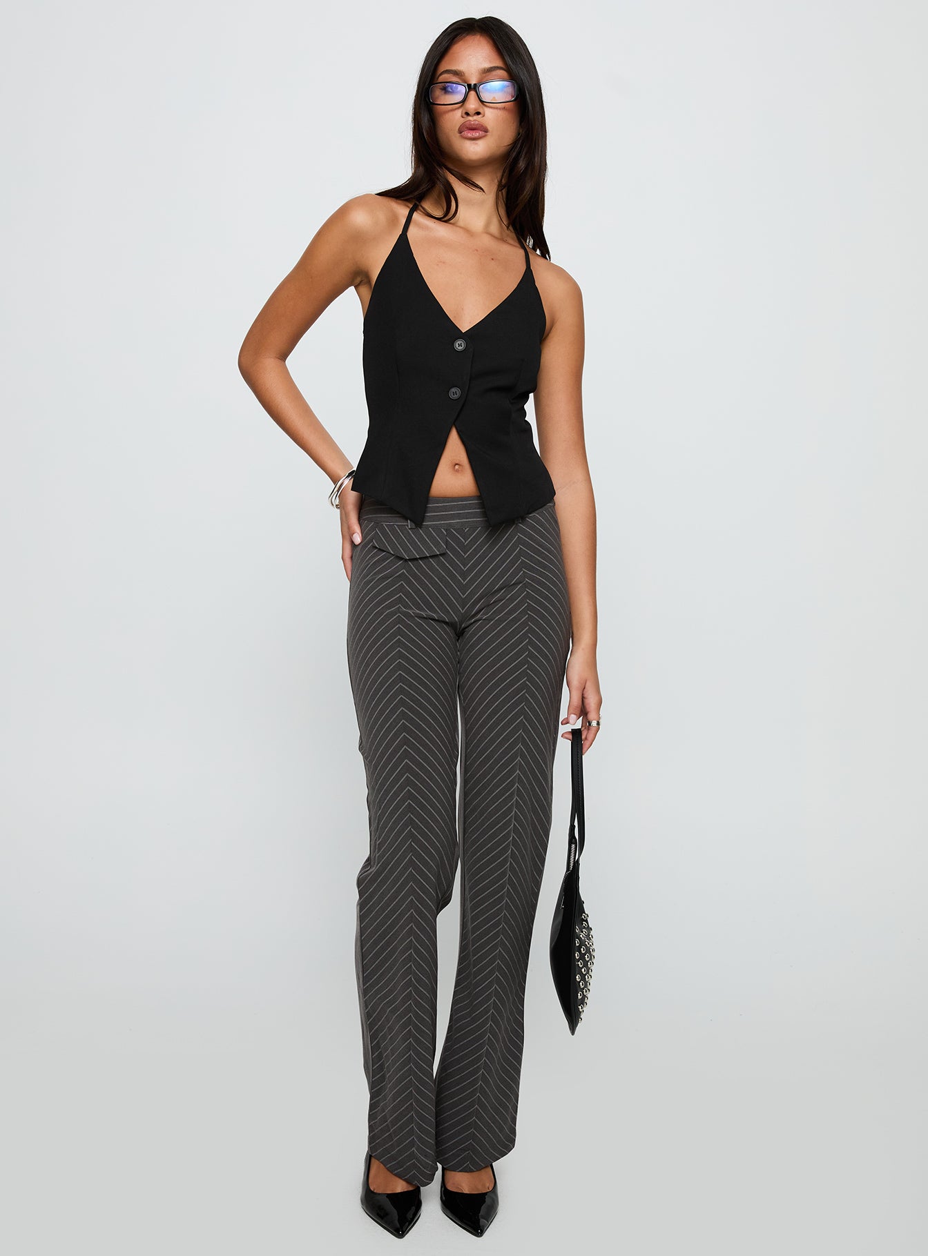 front view of model wearing Princess Polly No Sleep Halter Top Black Sleeveless V-Neck 