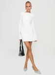 side view of model wearing Princess Polly Carters Long Sleeve Mini Dress White Petite High Neck 