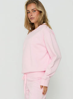 Explore the Wellness Off The Shoulder Jumper Pink womens-jumpers with short length side view of model wearing Princess Polly