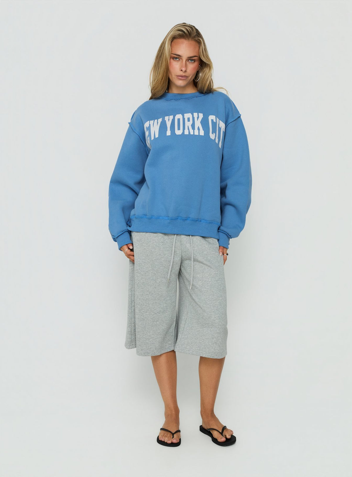 Featuring the When In New York City Oversized Jumper Blue womens jumper with long fit on-body Princess Polly