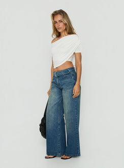 Crafted with Charlotta Low Rise Super Baggy Jeans Mid Blue womens-jeans side view of model wearing Princess Polly
