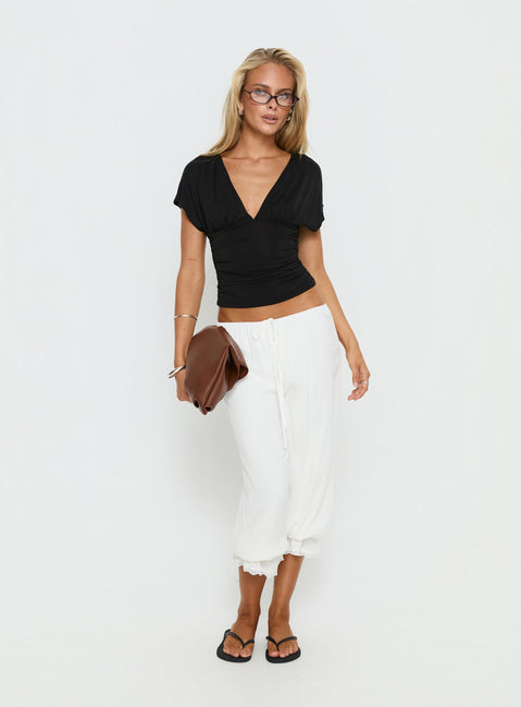 front view of model wearing Princess Polly Basma Bloomer Trouser Pants Rayon White Mid Rise Pants 