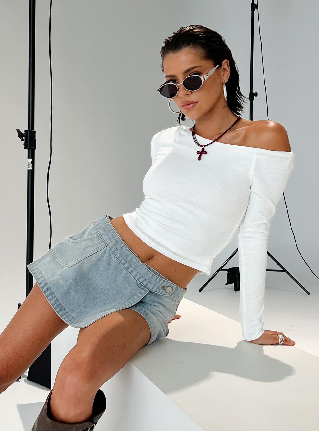 side view of model wearing Princess Polly Down For The Ride Denim Skort Light Wash Tall 