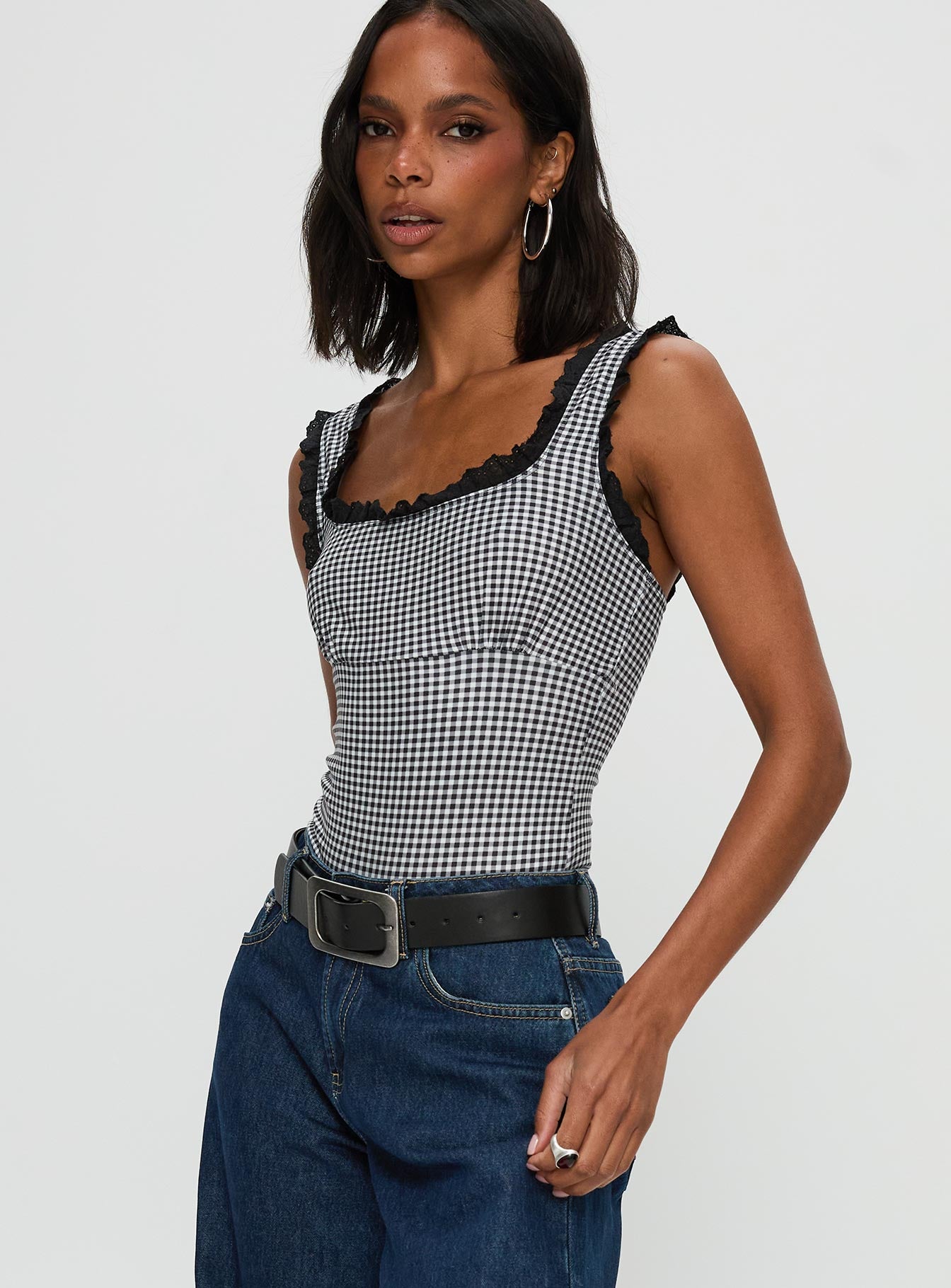 side view of model wearing Princess Polly Trustfund Lace Trim Bodysuit Black / White Check Sleeveless 