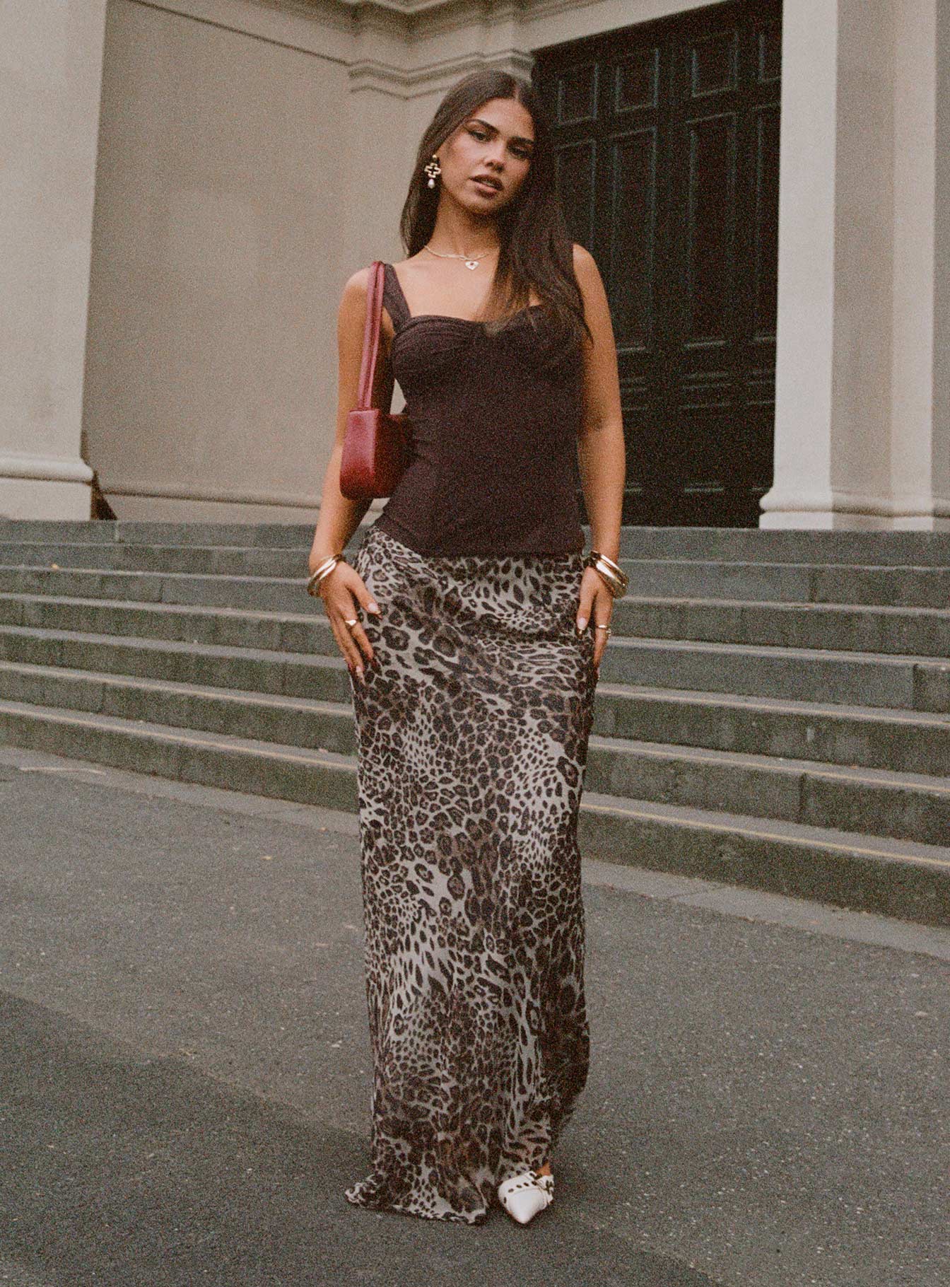  side view of model wearing Princess Polly Manda Maxi Skirt Leopard Maxi 