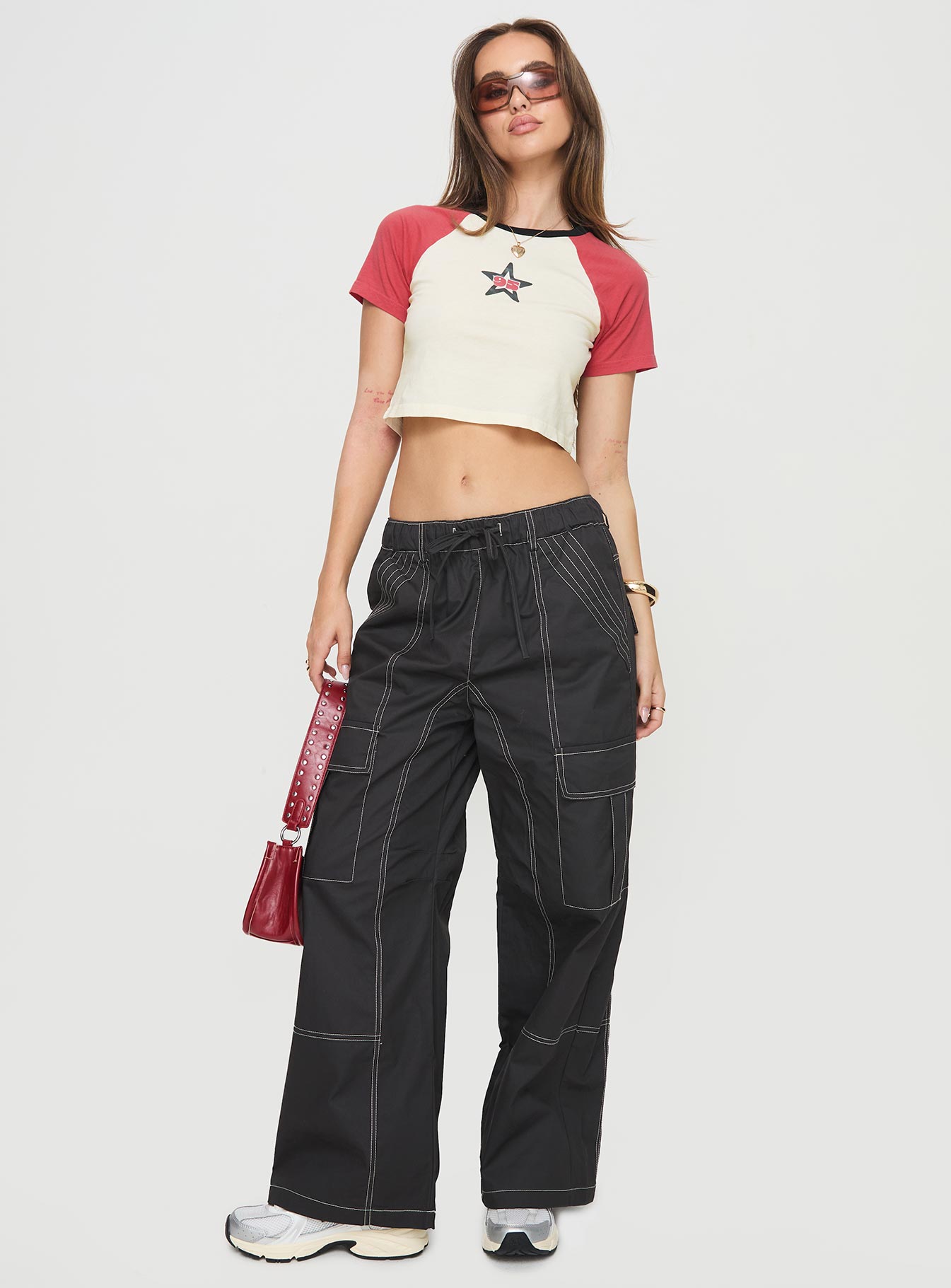 front view of model wearing Princess Polly Soria Cargo Pants Black Low Rise Pants 