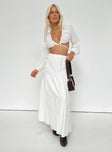 White matching set Long sleeve top Plunging neckline Adjustable coverage Tie fastening Maxi skirt Thick elasticated waistband Tiered skirt