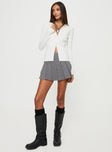 White Top  Long sleeves, classic collar, knit like material  Button fastening at front 