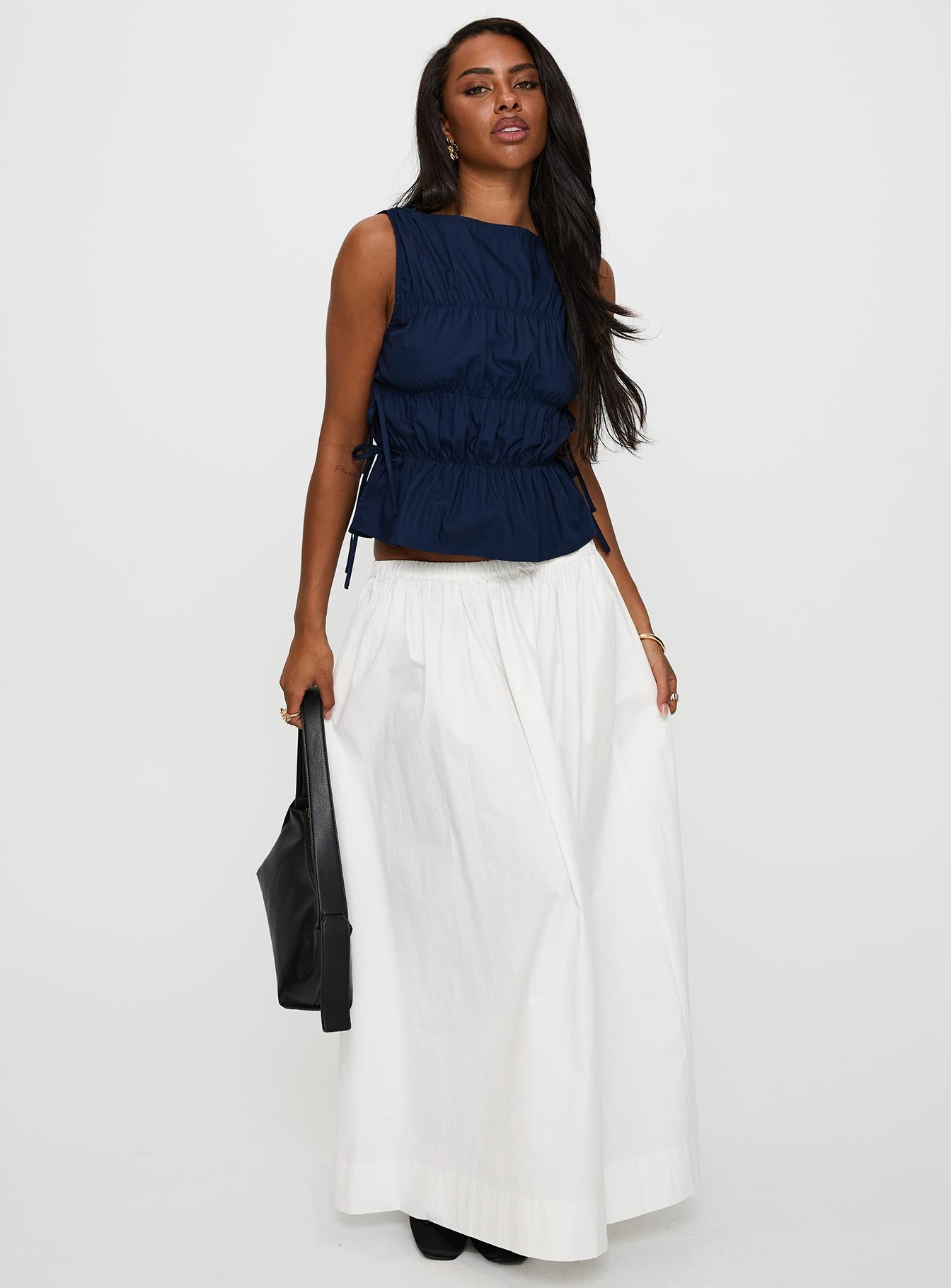 side view of model wearing Princess Polly Endless Summers Tie Side Top Navy Sleeveless High Neck 