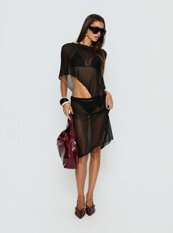   side view of model wearing Princess Polly Luminous Midi Skirt Black 