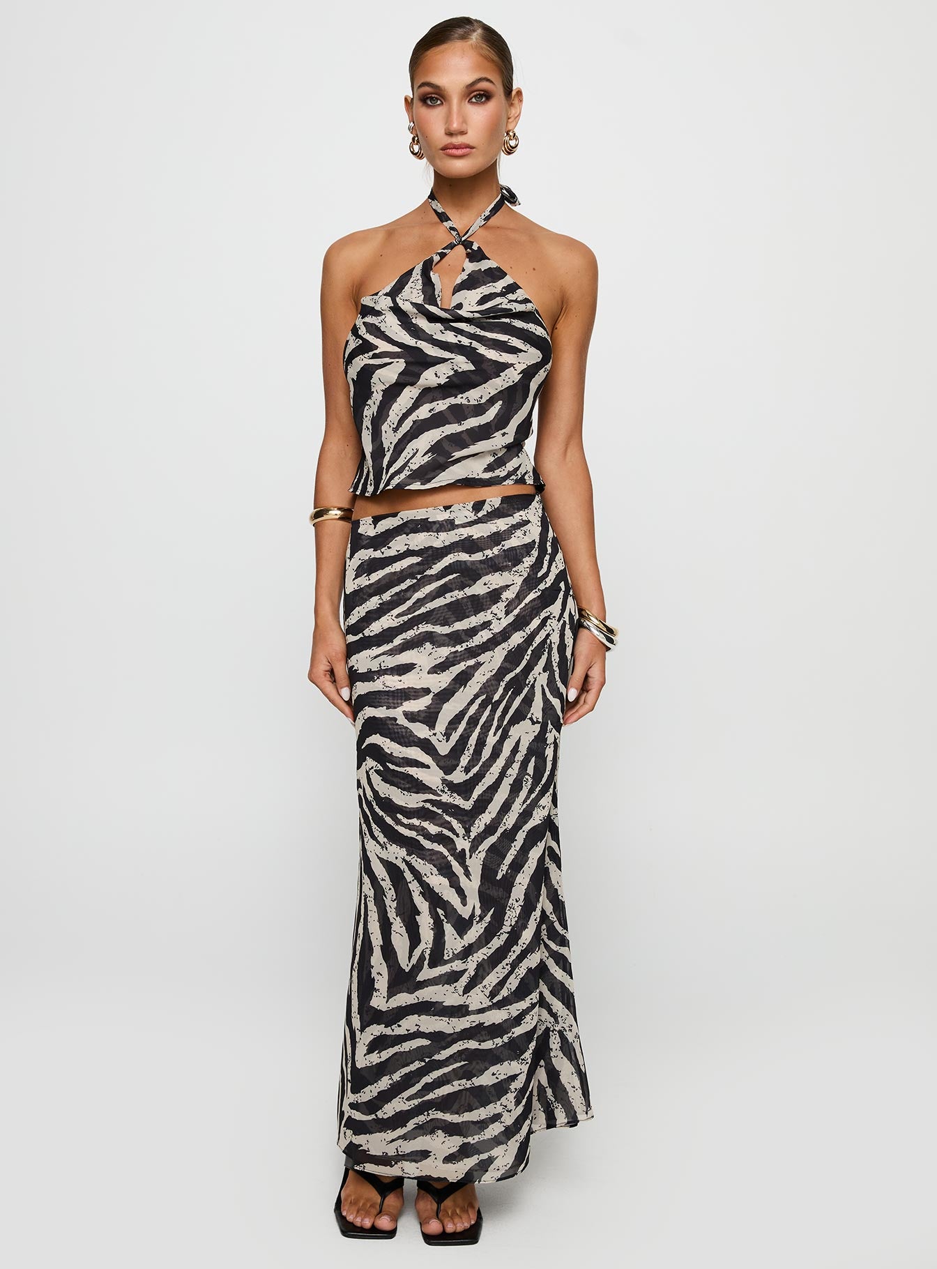 front view of model wearing Princess Polly Eleganza Top Zebra Sleeveless Cowl 
