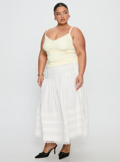   side view of model wearing Princess Polly Calling For You Flowy Maxi Skirt White Curve Maxi Skirts 