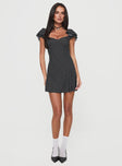 front view of model wearing Princess Polly Moretti Mini Dress Black Polka Dot Sweetheart Neckline 