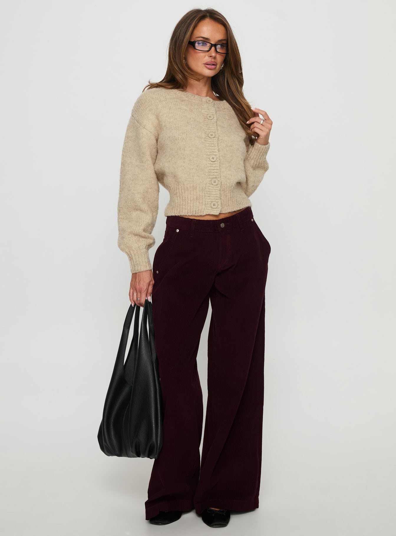 side view of model wearing Princess Polly Jacynda Low Waist Wide Leg Corduroy Jeans Currant Mid Rise Jeans 