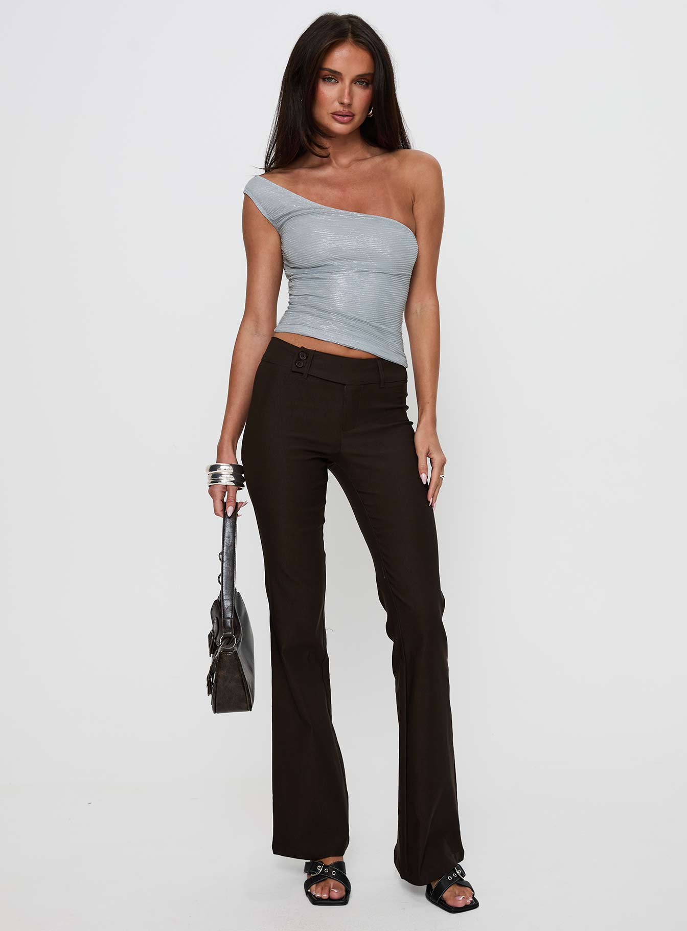 front view of model wearing Princess Polly Kinkirk Flared Pants Chocolate Petite Low Rise Pants 