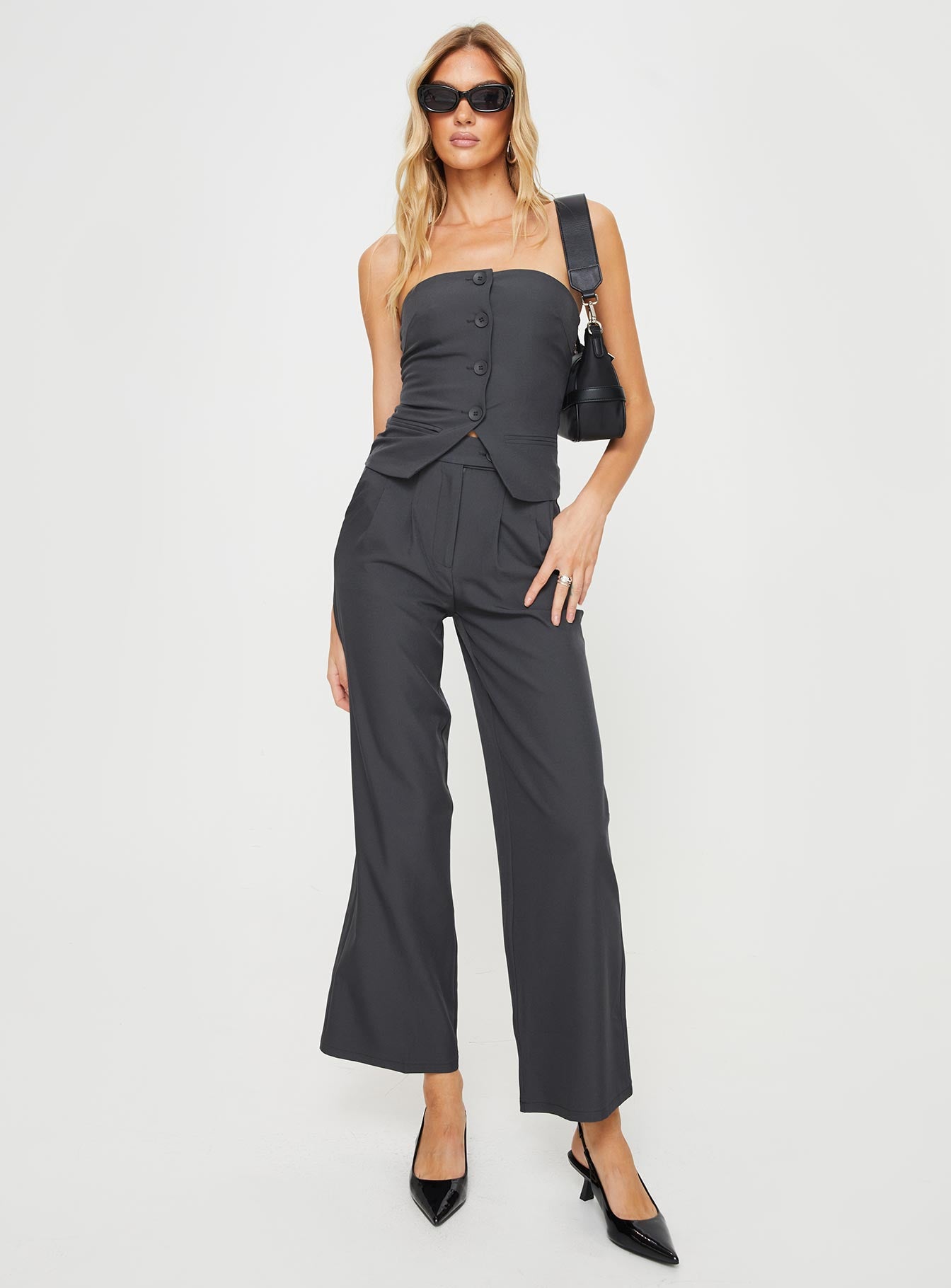 Matching set  Strapless slim-fitting top, faux front pockets, split hem Elasticated at back, silicone inner strip at bust, front button fastening Non-stretch, fully lined top High-waisted straight-leg pants, subtle pleats at the waist, twin hip pockets  Zip & button fastening Non-stretch, unlined  Princess Polly Lower Impact