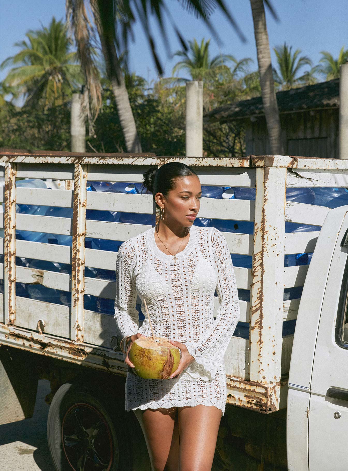 White Long sleeve mini dress Crochet style, high neckline, open back with tie fastening, flared sleeves