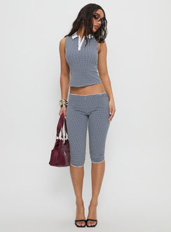 front view of model wearing Princess Polly Tuka Capri Navy Gingham Mid Rise Pants 