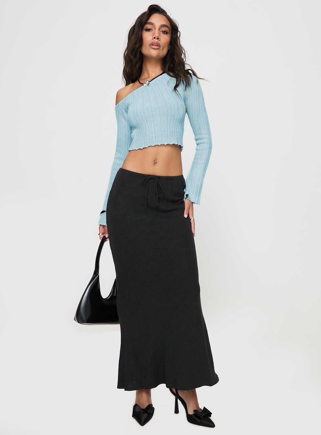 back view of model wearing Princess Polly Santorini Knit Top Blue Full Sleeves Asymmetric Neckline 