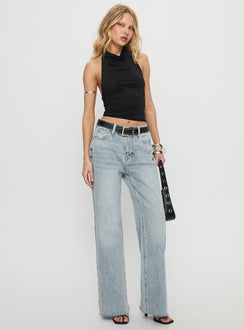 side view of model wearing Princess Polly Henesey High Rise Straight Leg Jeans Light Wash Mid Rise Jeans 