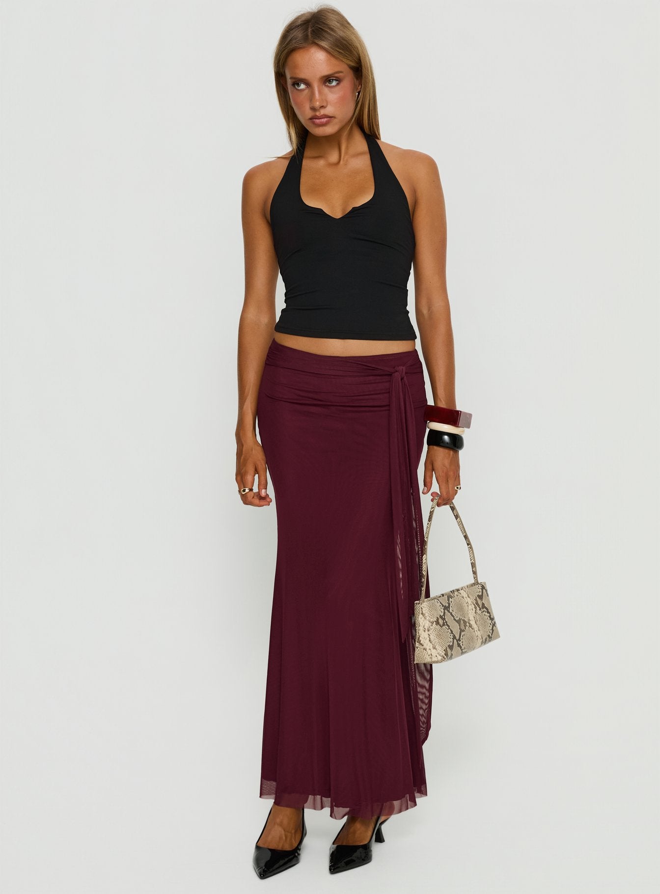   side view of model wearing Princess Polly Caviar Tie Maxi Skirt Currant Maxi Skirts 