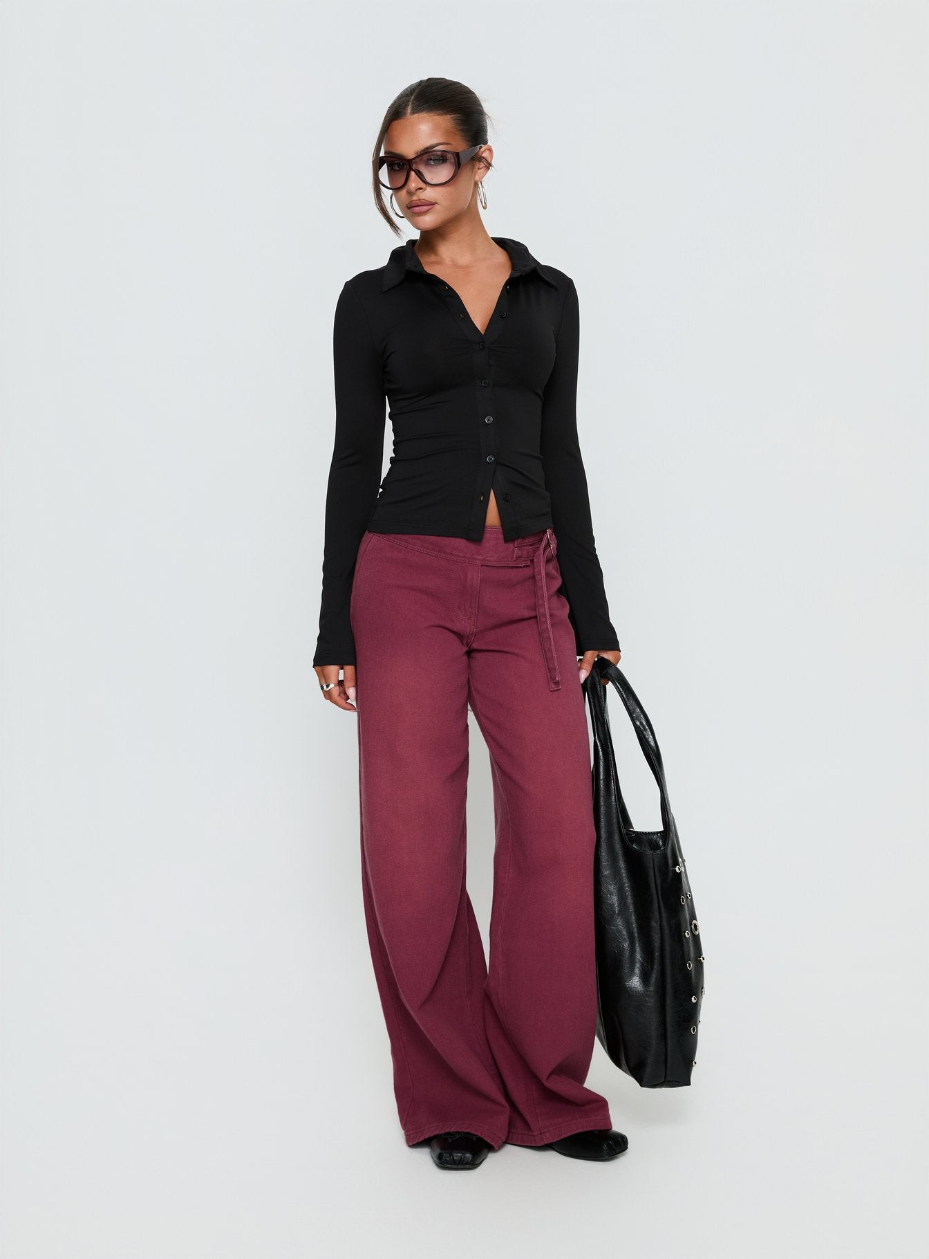 front view of model wearing Princess Polly Boxie Mid Rise Wide Leg Jeans Washed Burgundy Mid Rise Jeans 