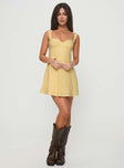 side view of model wearing Princess Polly Mcbeath Mini Dress Yellow Sweetheart Neckline 