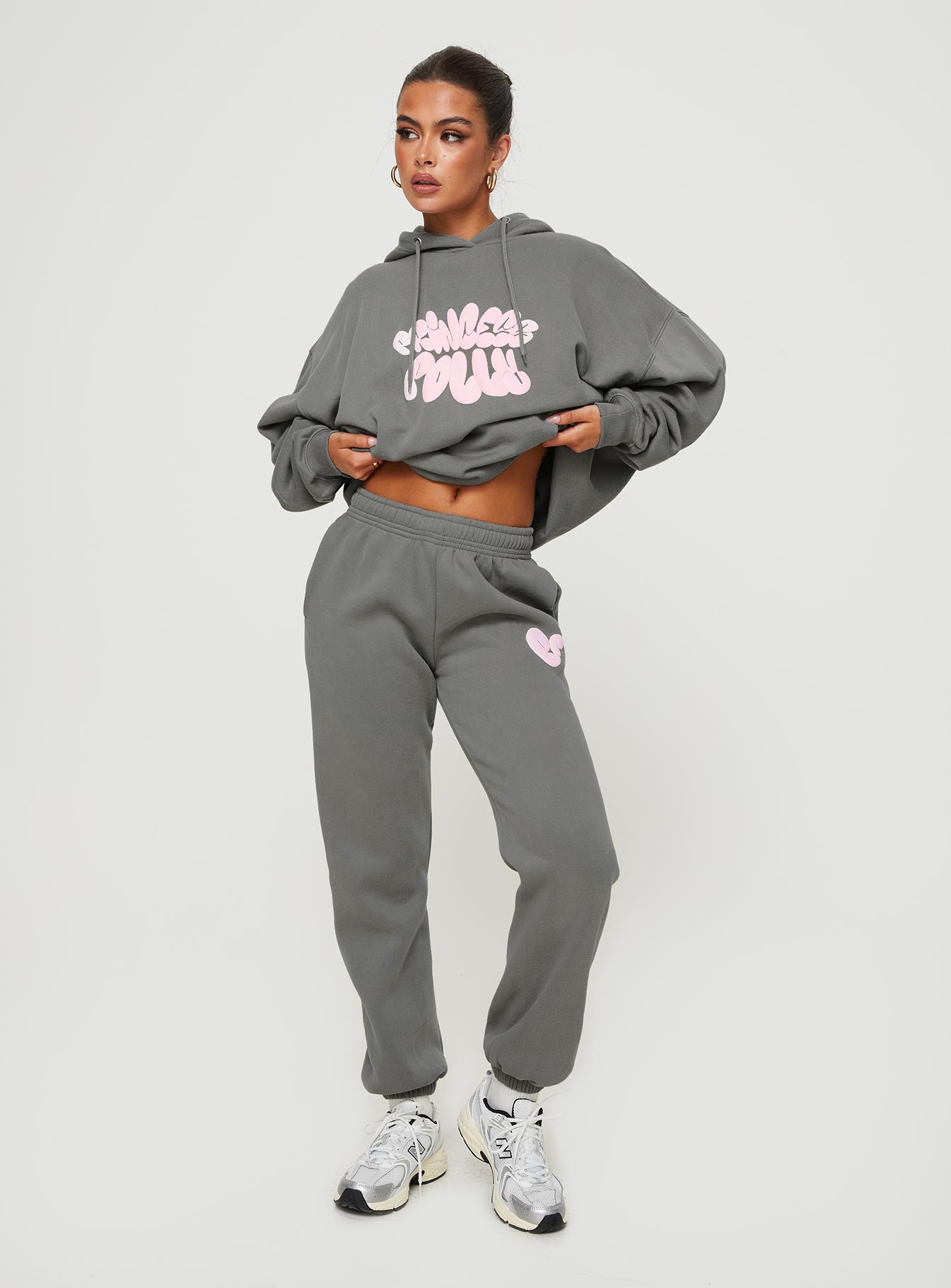 front view of model wearing Princess Polly Princess Polly Track Pants Bubble Text Charcoal / Light Pink Mid Rise 