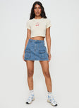 Front view of model wearing  front Chillders Denim Mini Skirt Mid Wash Petite Princess Polly  Mini Skirts 